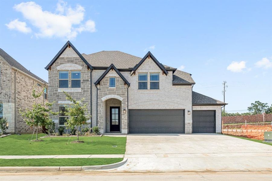 Front exterior of a new home in Mockingbird Hills 60-65, Joshua, TX, highlighting curb appeal (Image 1).