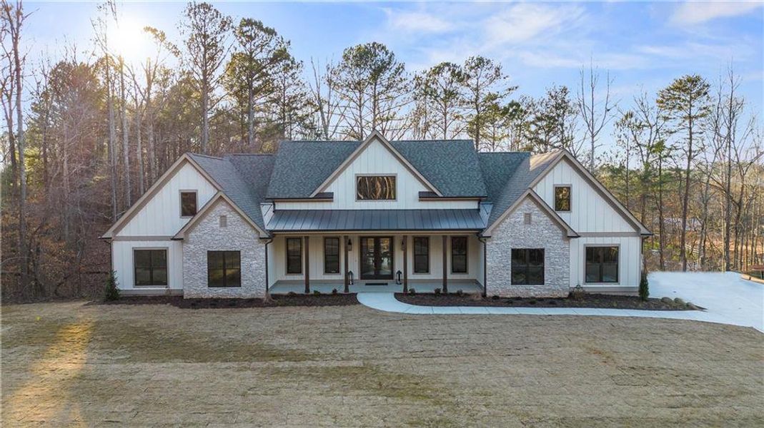 Front exterior of a new home in , Woodstock, GA, highlighting curb appeal (Image 26). Front exterior of a new home in , Woodstock, GA, highlighting curb appeal (Image 26).