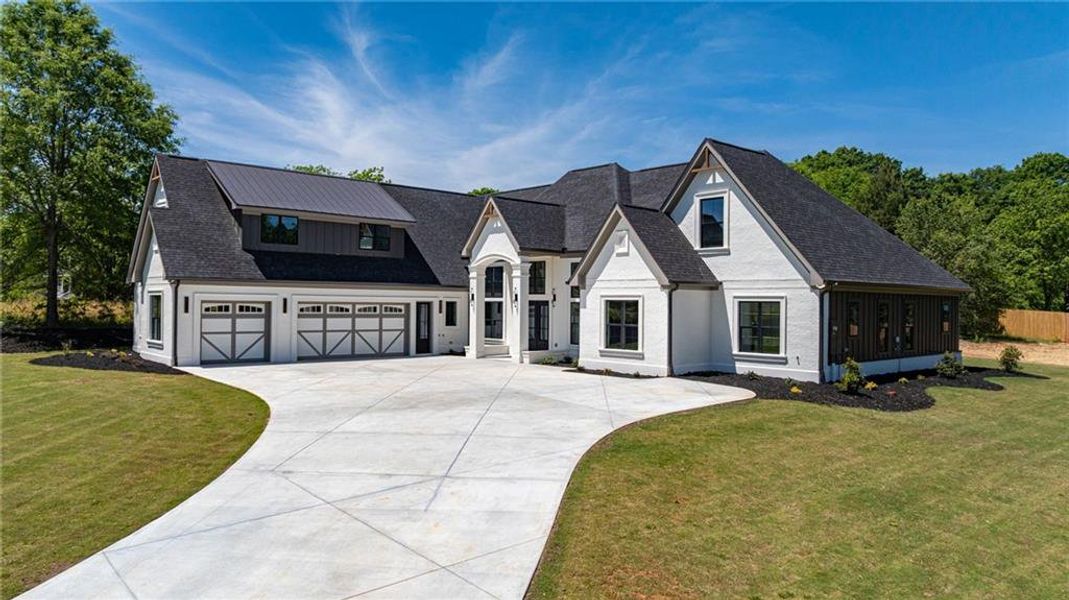 Front exterior of a new home in , Monroe, GA, highlighting curb appeal (Image 35).