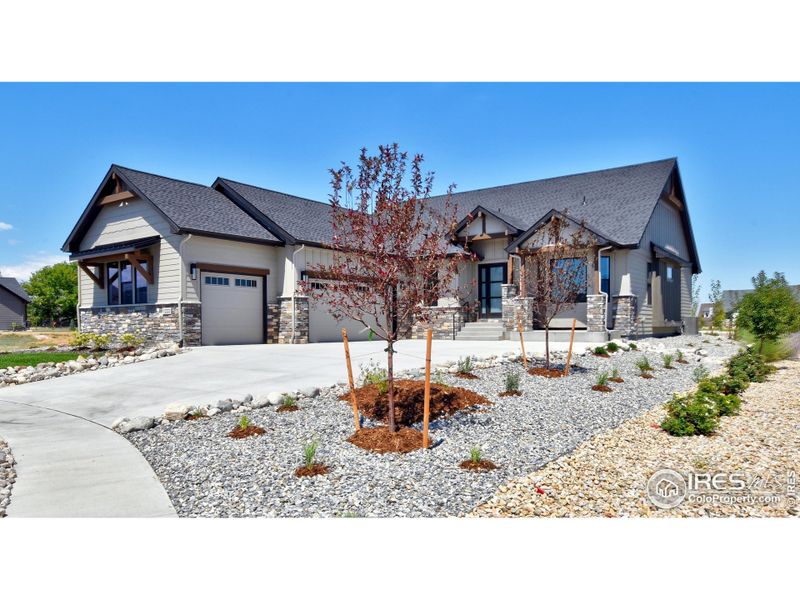Front exterior of a new home in , Berthoud, CO, highlighting curb appeal (Image 25).