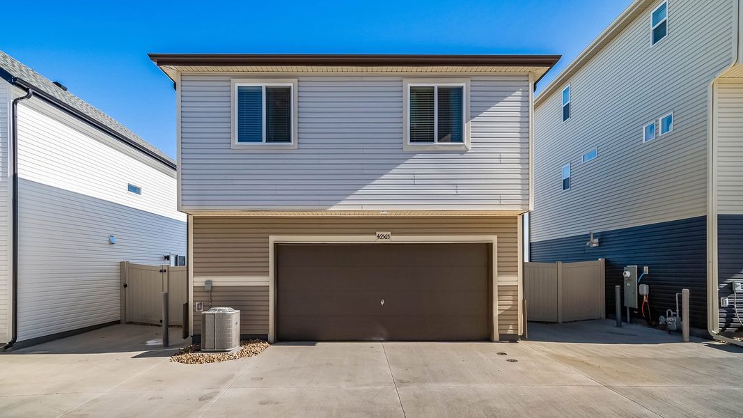 Front exterior of a new home in Muegge Farms, Bennett, CO, highlighting curb appeal (Image 1). Front exterior of a new home in Muegge Farms, Bennett, CO, highlighting curb appeal (Image 1).