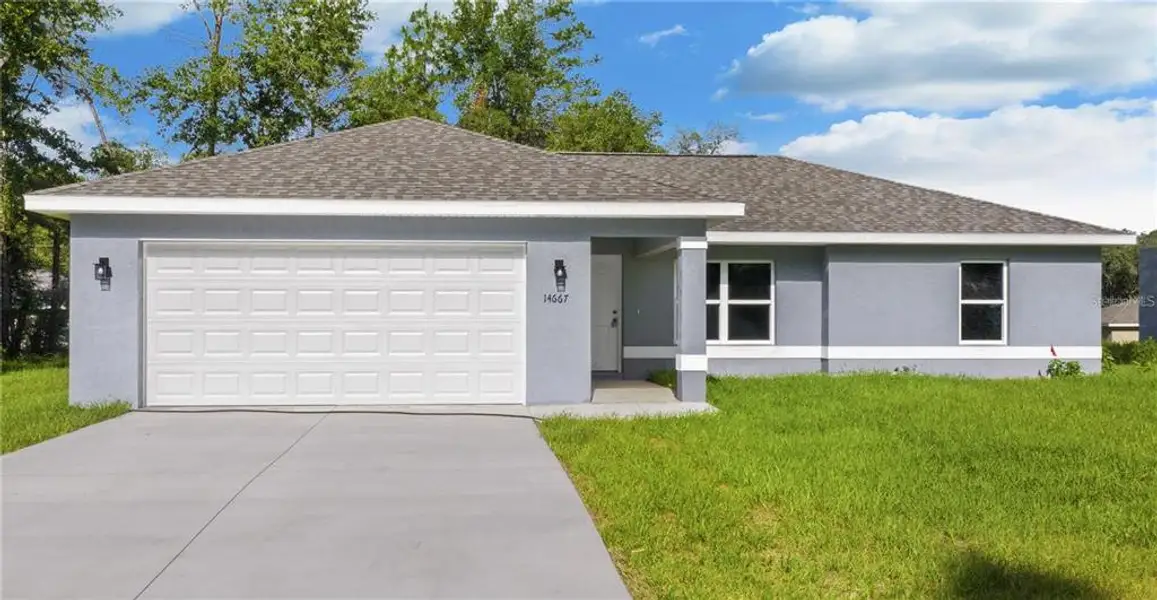 Front exterior of a new home in , Ocala, FL, highlighting curb appeal (Image 2). Front exterior of a new home in , Ocala, FL, highlighting curb appeal (Image 2).