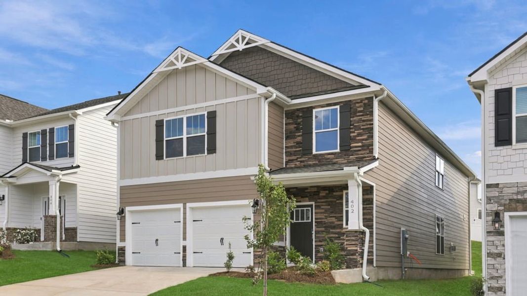 Front exterior of a new home in Adams Glen, Greenville, SC, highlighting curb appeal (Image 2). Front exterior of a new home in Adams Glen, Greenville, SC, highlighting curb appeal (Image 2).