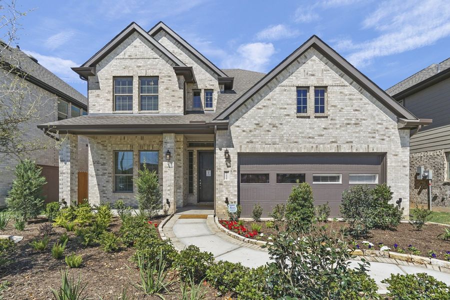 Front exterior of a new home in Wood Leaf Reserve, Tomball, TX, highlighting curb appeal (Image 25).