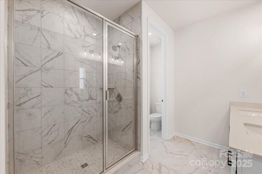 En Suite Primary Bath with Modern Tile Design. En Suite Primary Bath with Modern Tile Design.