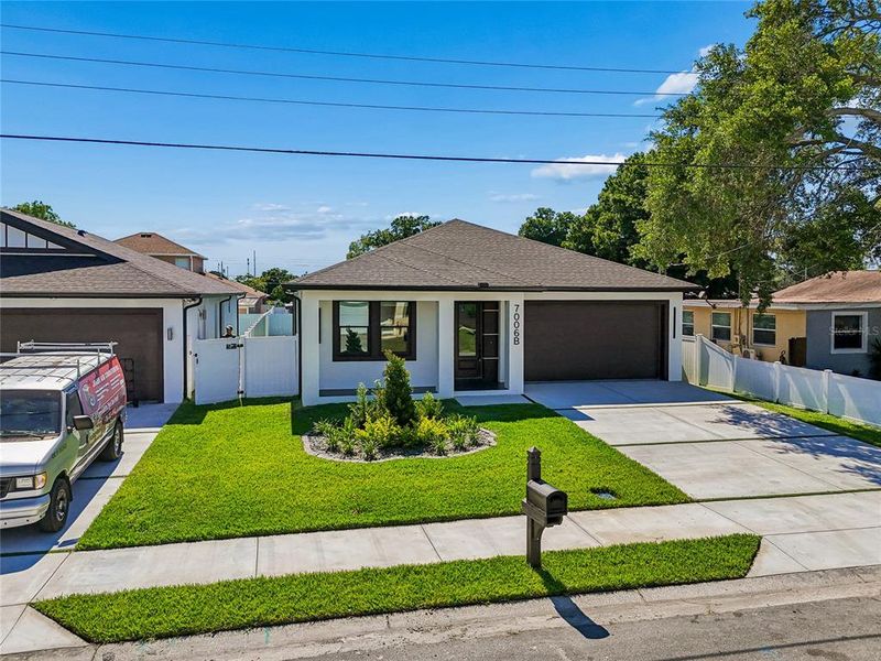 Front exterior of a new home in , Tampa, FL, highlighting curb appeal (Image 34).