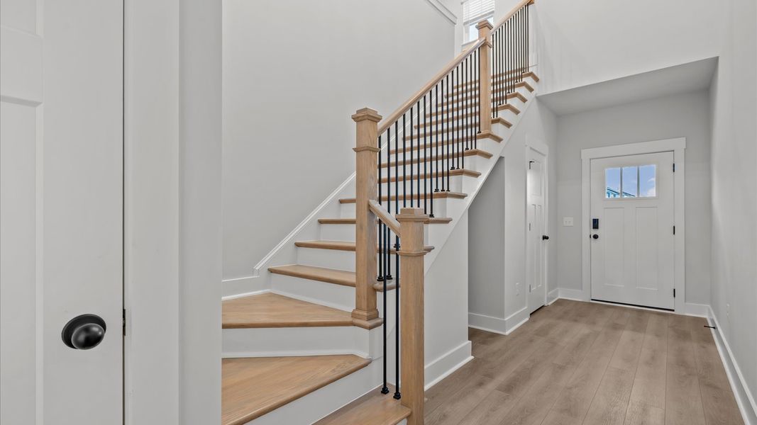 Accomplished hardwood flooring foyer sets the tone for tasteful design throughout the home Accomplished hardwood flooring foyer sets the tone for tasteful design throughout the home