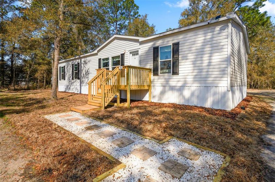 Exterior details and patio area of a home in , Bronson (Image 24).