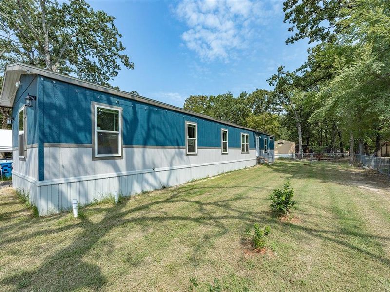 Front exterior of a new home in , Gun Barrel City, TX, highlighting curb appeal (Image 24). Front exterior of a new home in , Gun Barrel City, TX, highlighting curb appeal (Image 24).