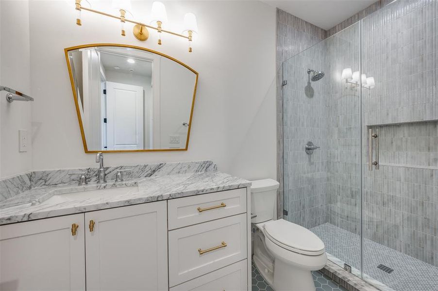 Full bathroom featuring vanity and a stall shower Full bathroom featuring vanity and a stall shower