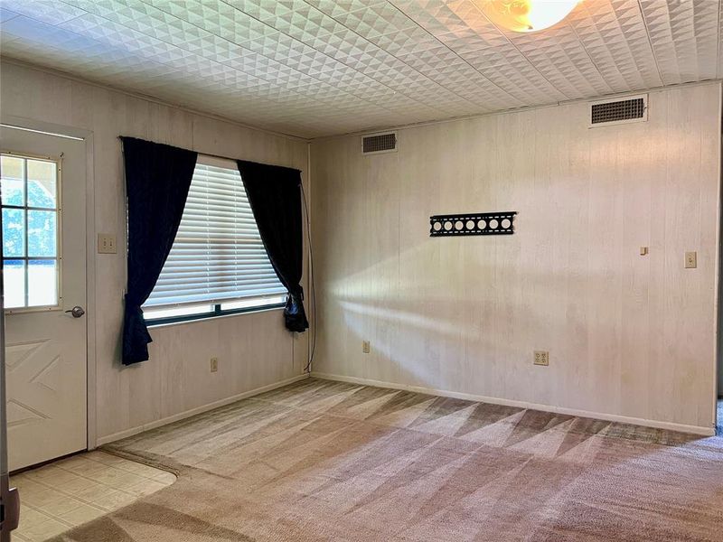 Livingroom featuring carpet floors and baseboards Livingroom featuring carpet floors and baseboards