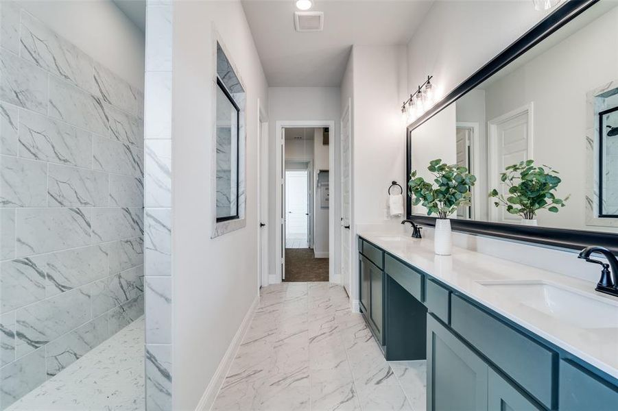 Bathroom featuring vanity and walk in shower