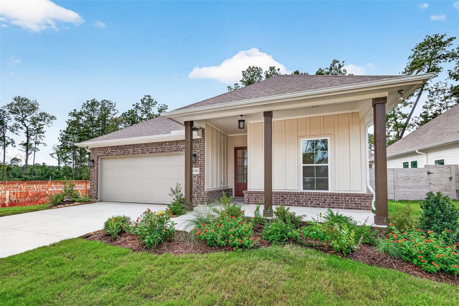 Front exterior of a new home in Two Step Farm, Montgomery, TX, highlighting curb appeal (Image 2). Front exterior of a new home in Two Step Farm, Montgomery, TX, highlighting curb appeal (Image 2).
