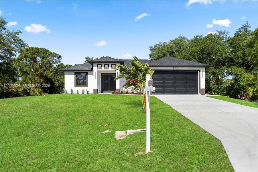 Front exterior of a new home in , Lehigh Acres, FL, highlighting curb appeal (Image 21).