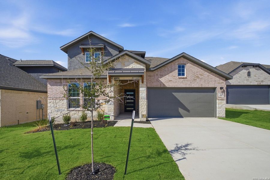 Front exterior of a new home in The Woodlands at Medina Hills, Mico, TX, highlighting curb appeal (Image 2).