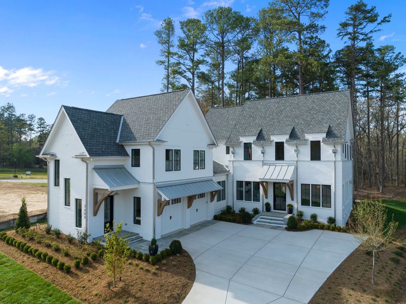Representative exterior photo of a completed home built from the Eloise by Homes by Dickerson in The Founding at Blue Ridge, Raleigh, NC (Image 27). Representative exterior photo of a completed home built from the Eloise by Homes by Dickerson in The Founding at Blue Ridge, Raleigh, NC (Image 27).