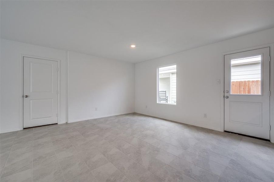 Tiled empty room with a healthy amount of sunlight Tiled empty room with a healthy amount of sunlight