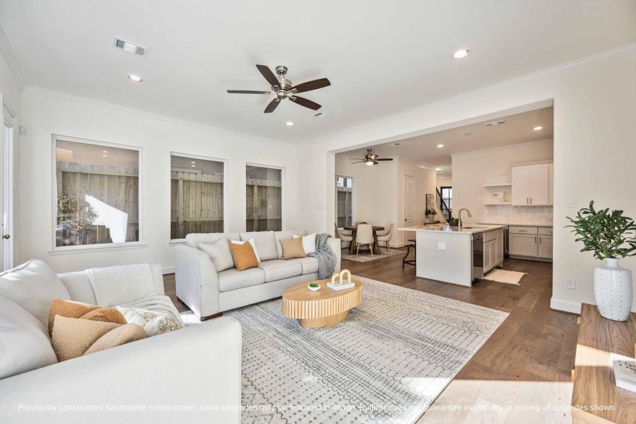 This wide-angle view shows off the magic of first-floor living—kitchen, dining, and living all connected in one beautifully cohesive space. This wide-angle view shows off the magic of first-floor living—kitchen, dining, and living all connected in one beautifully cohesive space.