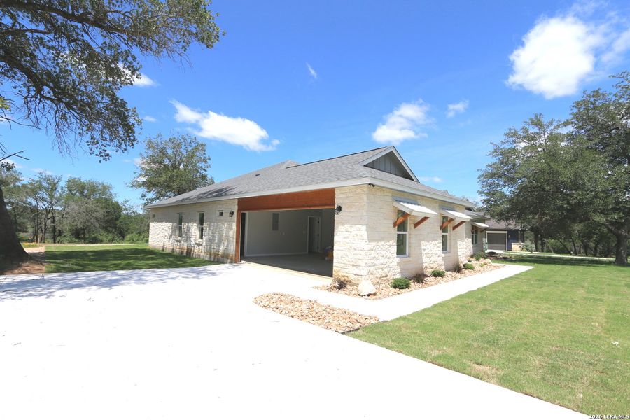 Front exterior of a new home in , La Vernia, TX, highlighting curb appeal (Image 17). Front exterior of a new home in , La Vernia, TX, highlighting curb appeal (Image 17).