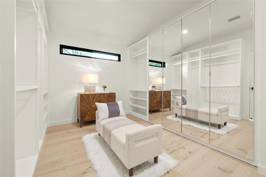 spacious walk-in closet with closet system