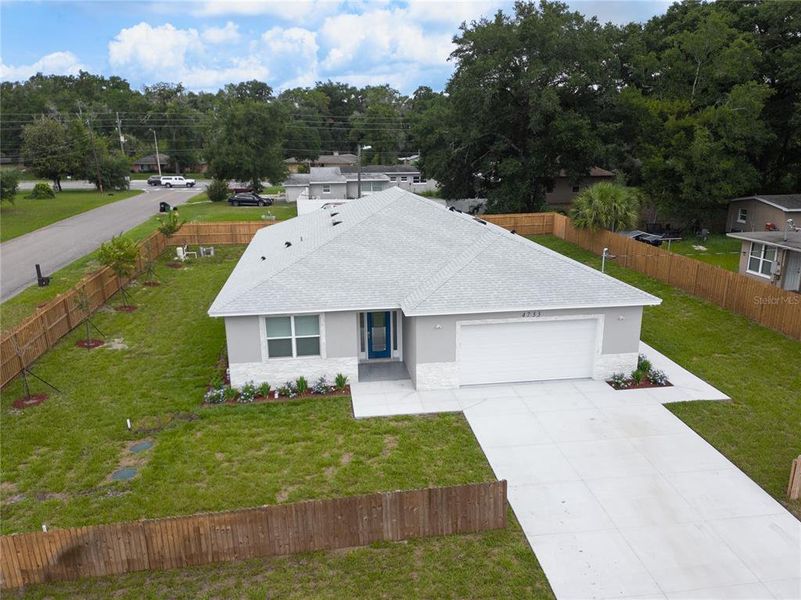 Front exterior of a new home in , Orlando, FL, highlighting curb appeal (Image 18).