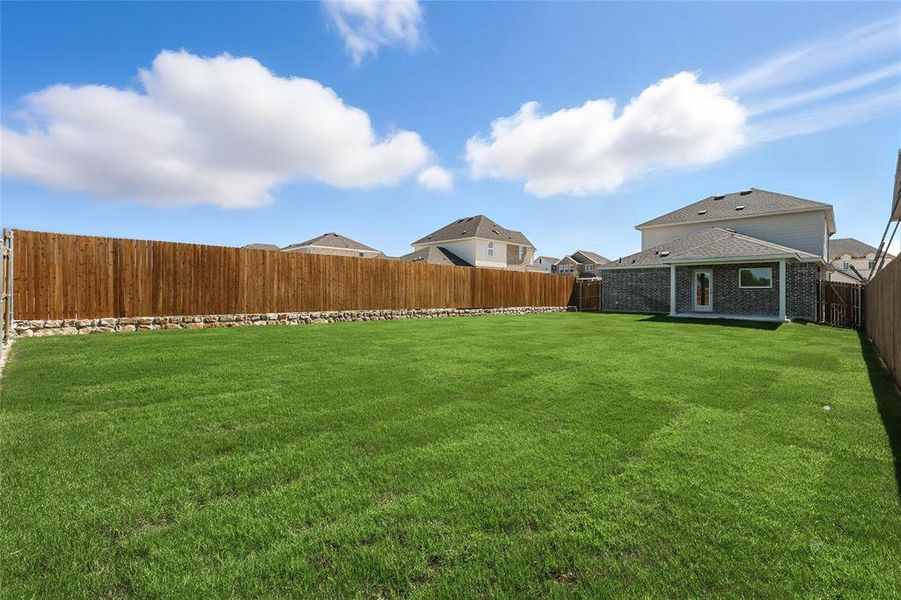 Fenced backyard with a patio Fenced backyard with a patio