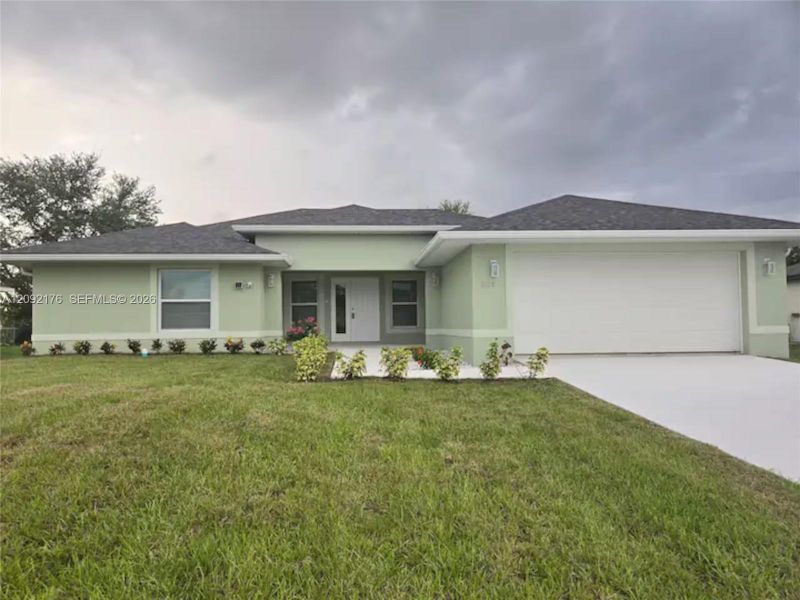 Front exterior of a new home in , Cape Coral, FL, highlighting curb appeal (Image 1). Front exterior of a new home in , Cape Coral, FL, highlighting curb appeal (Image 1).