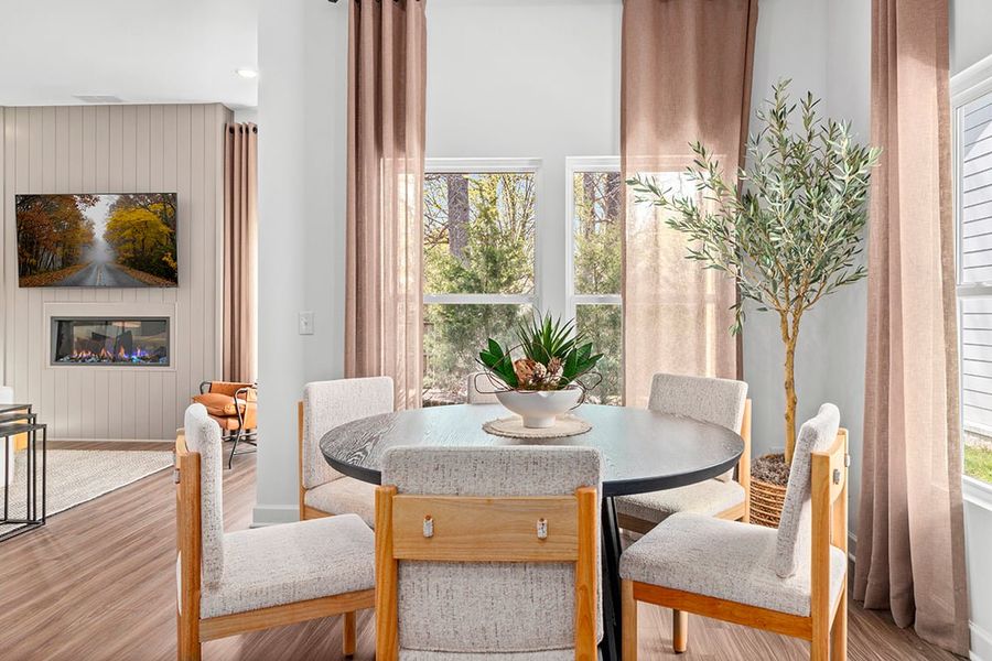 A room with a table and chairs.