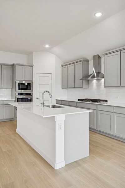 Kitchen in the Gilmour II home plan by Trophy Signature Homes – REPRESENTATIVE PHOTO (sterling)