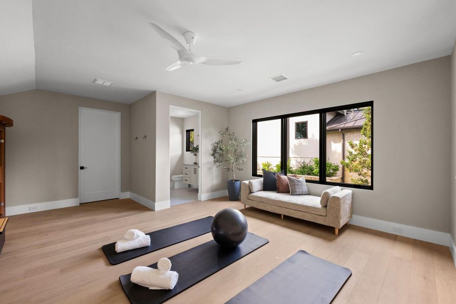 A private wellness sanctuary. Reached via a dedicated second staircase, this health suite features a workout area, custom sauna, cold plunge, and full bath
