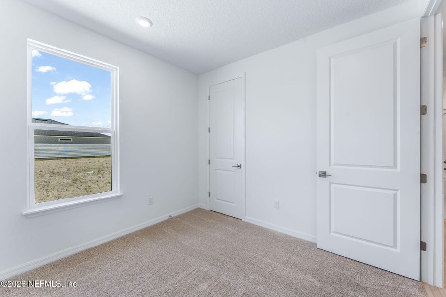 Spacious, unfurnished interior of a new home in Del Webb Wildlight, Yulee (Image 35).