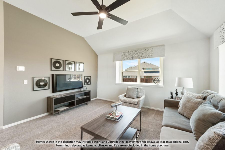 Living room with vaulted ceiling, ceiling fan, carpet flooring, and wall-mounted TV with media console Living room with vaulted ceiling, ceiling fan, carpet flooring, and wall-mounted TV with media console