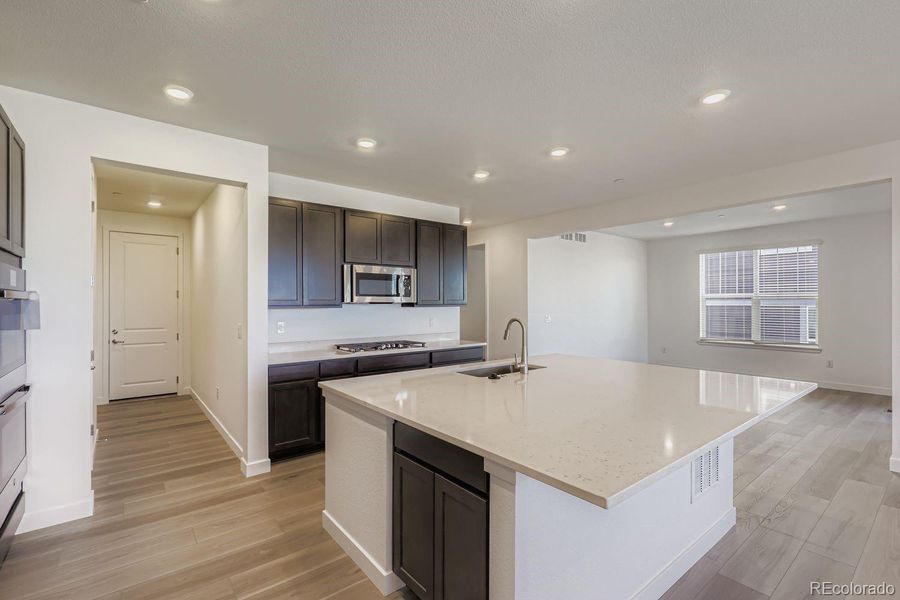 Furnished interior view inside a new home in Sunset Village: The Grand Collection, Erie (Image 6).