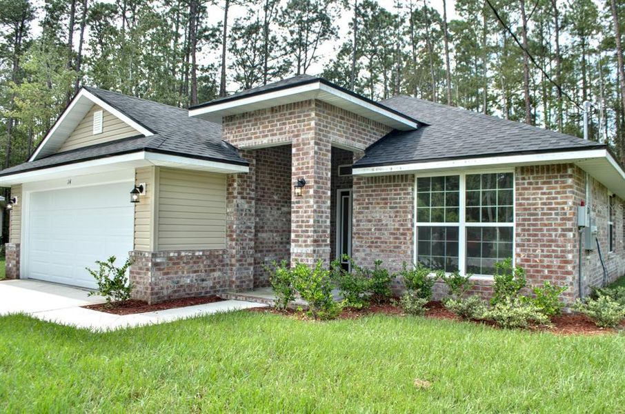 Front exterior of a new home in , Palm Coast, FL, highlighting curb appeal (Image 19). Front exterior of a new home in , Palm Coast, FL, highlighting curb appeal (Image 19).