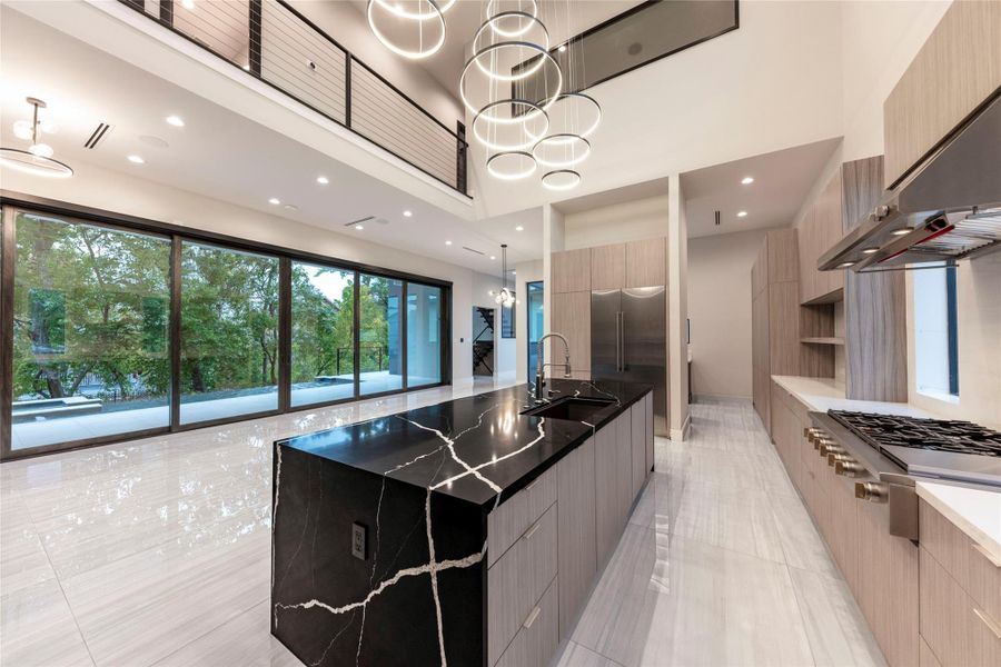 Example of Builders previously built home with similar finishes. Featuring an open-concept design and high ceilings, offering an airy, sophisticated living experience.