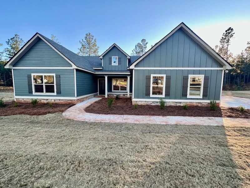 Front exterior of a new home in Perkins Place, Hogansville, GA, highlighting curb appeal (Image 1).