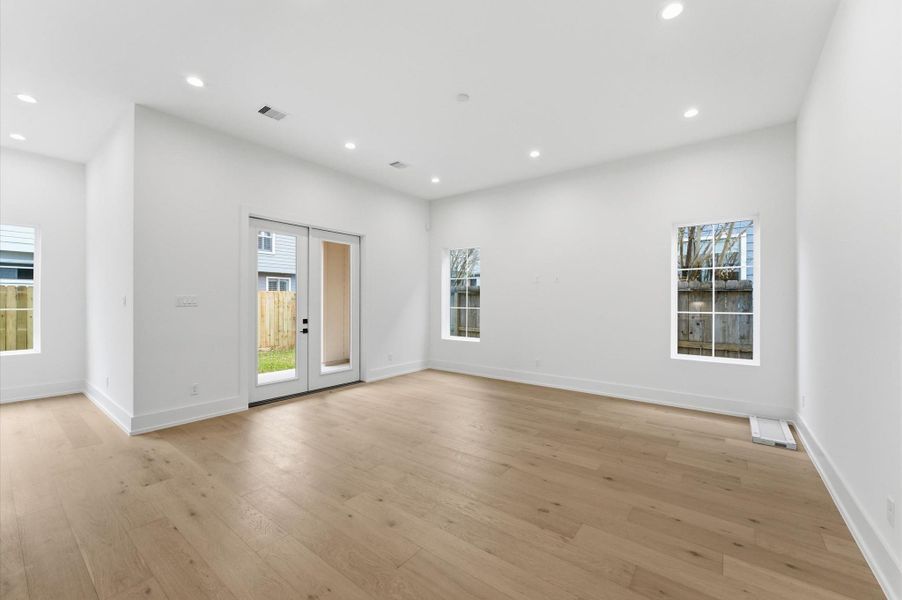Spacious living area with doors leading to the covered patio.