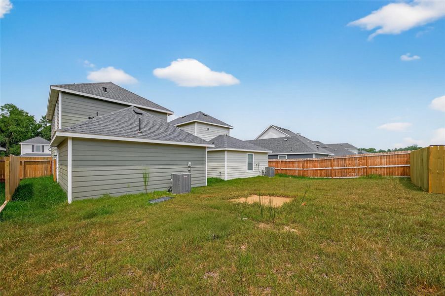 Front exterior of a new home in Marie Village, Conroe, TX, highlighting curb appeal (Image 14). Front exterior of a new home in Marie Village, Conroe, TX, highlighting curb appeal (Image 14).