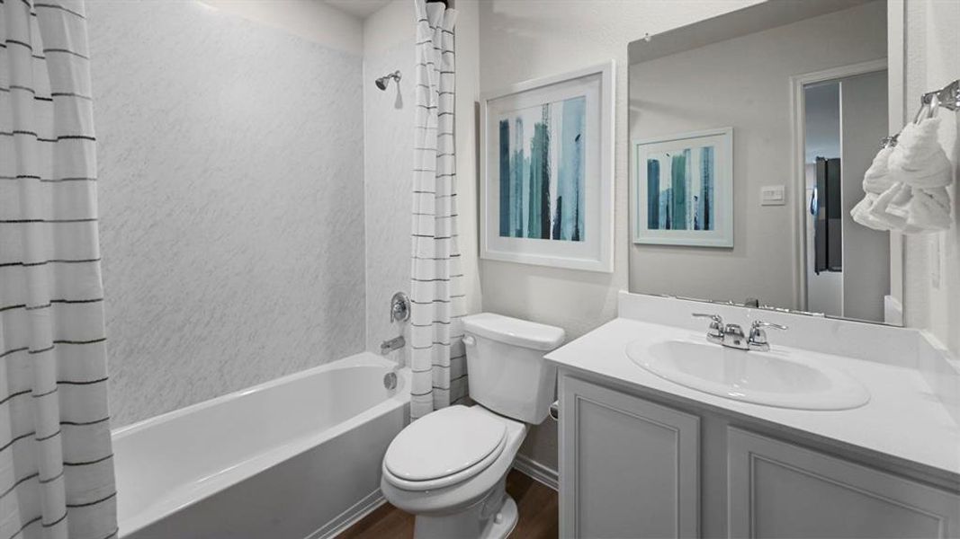 Full bath with shower / bath combination with curtain and vanity Full bath with shower / bath combination with curtain and vanity