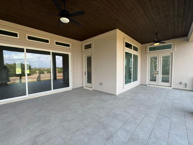 View of patio / terrace featuring ceiling fan and french doors