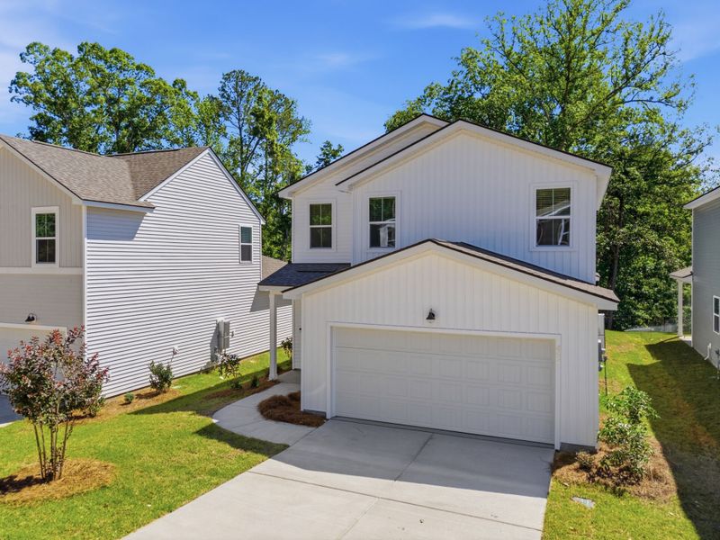 Front exterior of a new home in Grand Arbor, Blythewood, SC, highlighting curb appeal (Image 18).