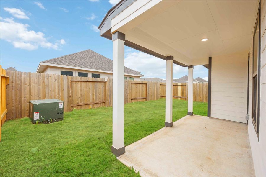 Enjoy a cup of coffee or beverage of choice on this spacious covered patio!