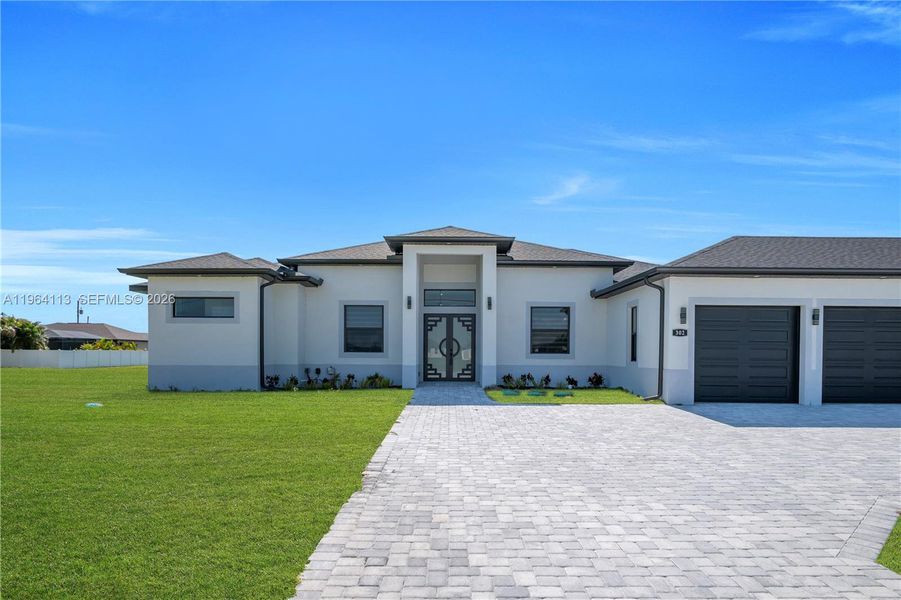 Front exterior of a new home in , Cape Coral, FL, highlighting curb appeal (Image 24).