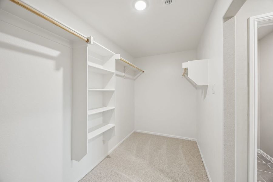 Primary Closet in the Sabrina home plan by Trophy Signature Homes – REPRESENTATIVE PHOTO