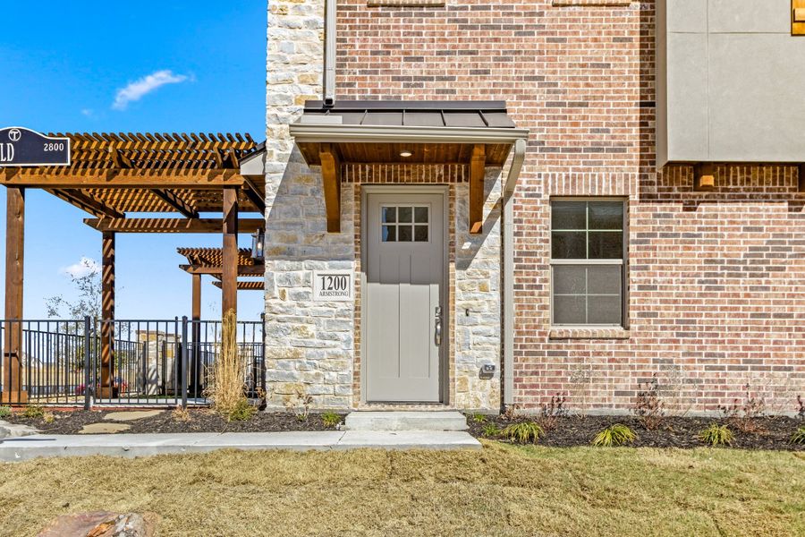 Exterior details and patio area of a home in The Tribute, The Colony (Image 27).