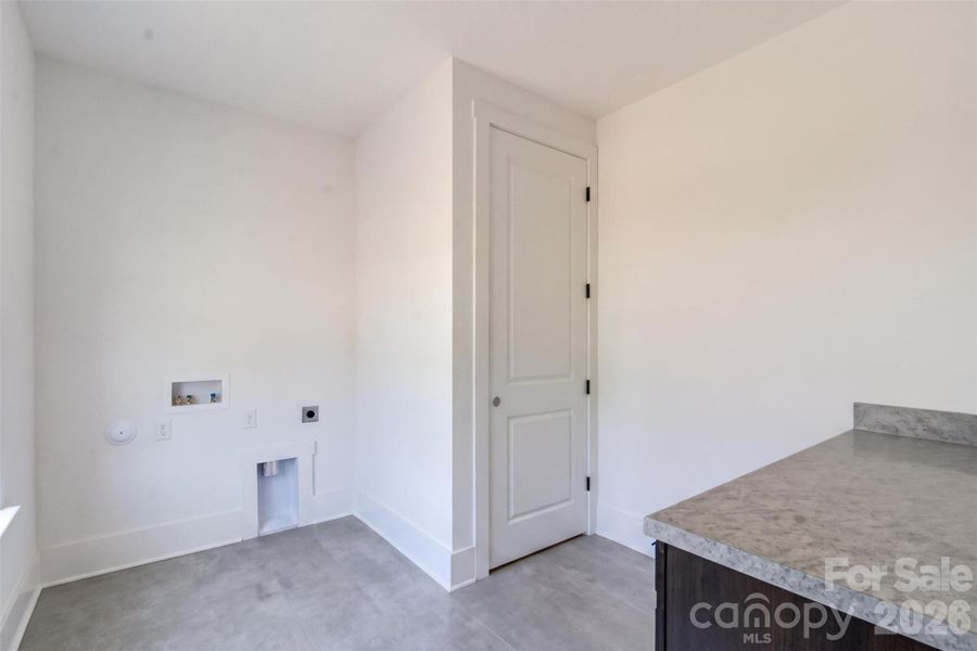 Laundry Room with Folding Table Laundry Room with Folding Table