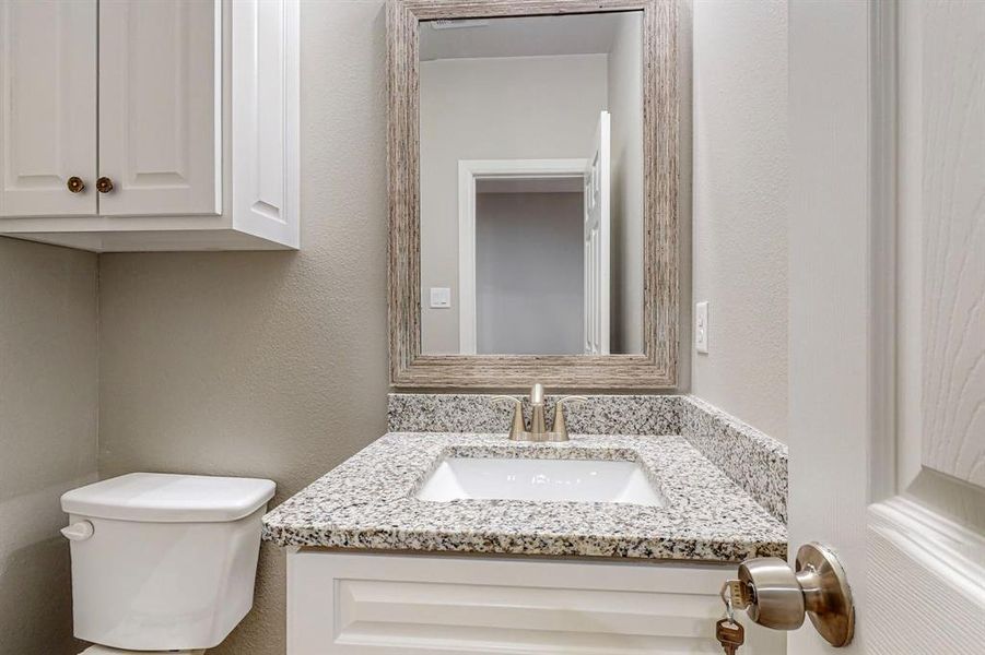 Bathroom featuring toilet and vanity