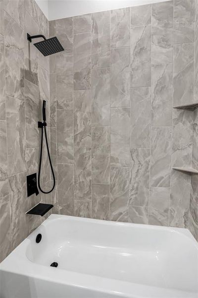 Bathroom featuring washtub / shower combination Bathroom featuring washtub / shower combination