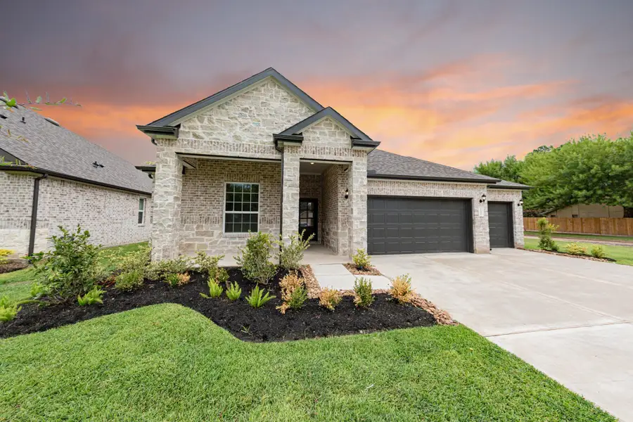 Front exterior of a new home in Lake Conroe Area Homes, Montgomery, TX, highlighting curb appeal (Image 2). Front exterior of a new home in Lake Conroe Area Homes, Montgomery, TX, highlighting curb appeal (Image 2).