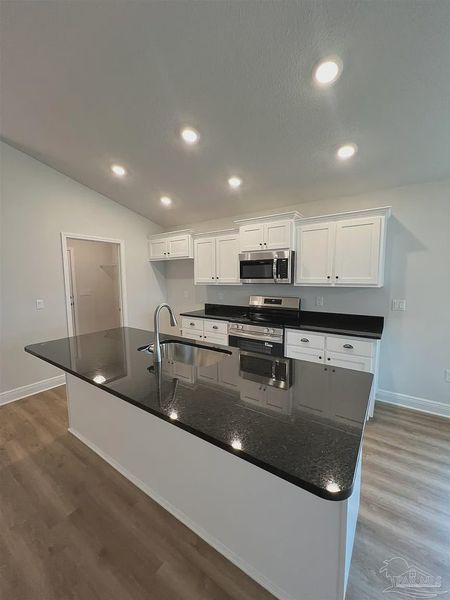 Furnished interior view inside a new home in Pine Top, Cantonment (Image 3).